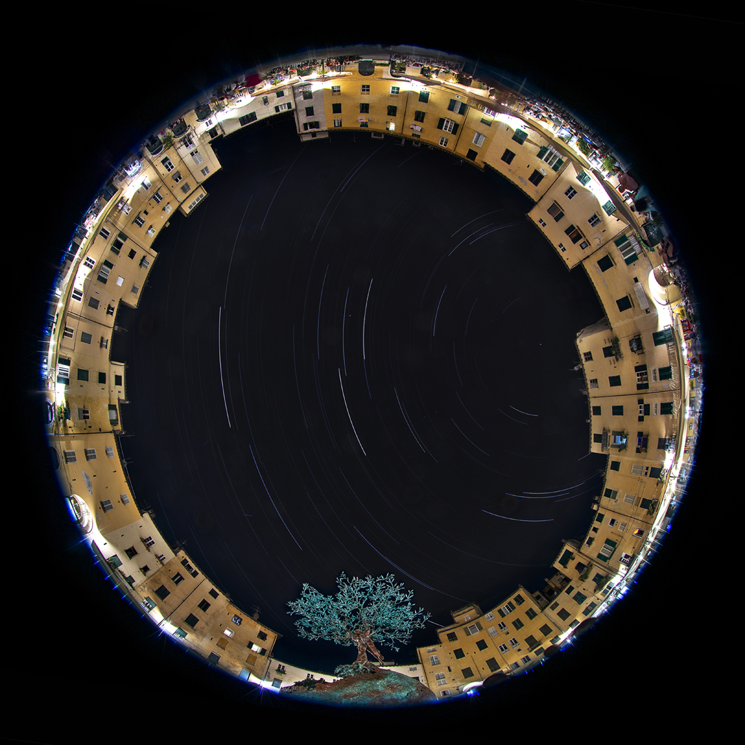 2ème Prix In Town. Startrail above Lucca Anpheteathre, Lucca, Italy. Canon Eos 1DxMk2, fisheye 8-15mm f5.6, 1030 shots of 6 sec, 200iso